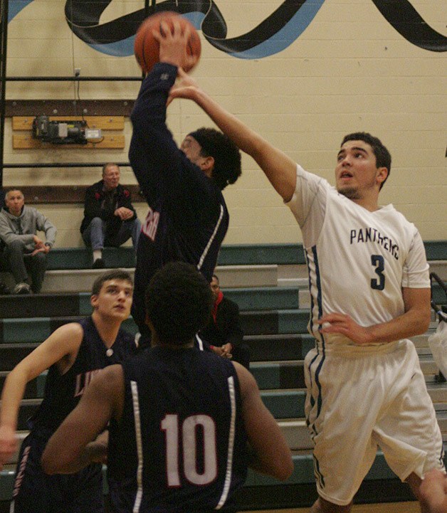 The Panther's J.C. Herd fights for a rebound Friday against Lindbergh at Bonney Lake High.