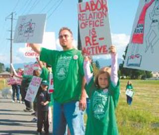 Rainier School employees take their complaints to the streets