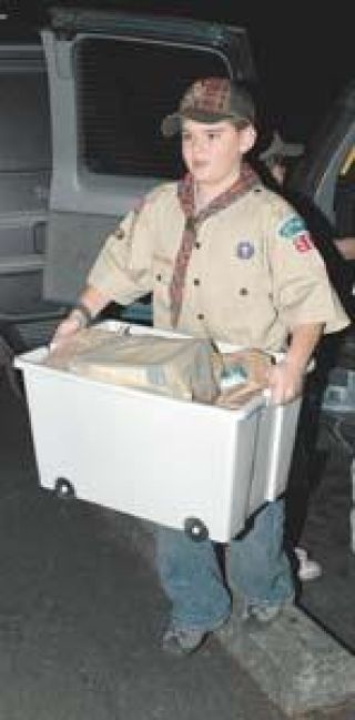 Cub Scouts deliver the goods to the food bank