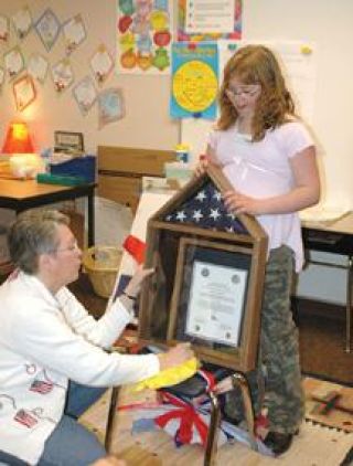 Dieringer student receives flag from soldier in Iraq