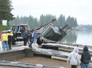 Vehicle slips off dock into Lake Tapps