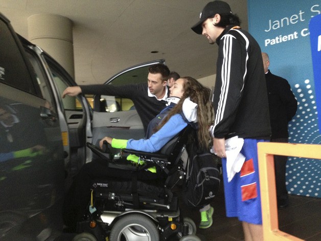 Jacoby Miles is shown the ADA friendly car donated to her family.