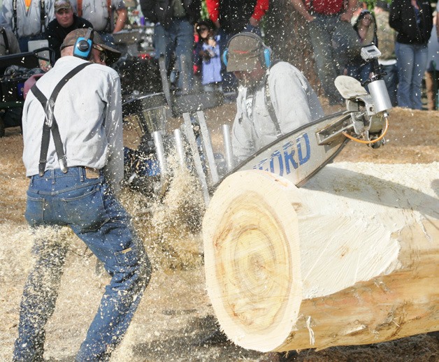 Rod Boustead and Darrell Durbin compete in the Buckley Log Show Saturday with the Insanesaw.