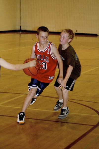 Griffin Webb makes a move for the hoop in the recent Plateau Pro Hoop Camp at EHS.