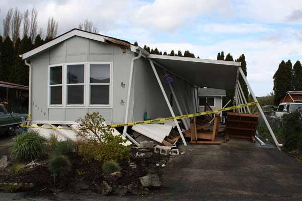 A home in Rainier Manor in Sumner was hit by a truck Tuesday morning