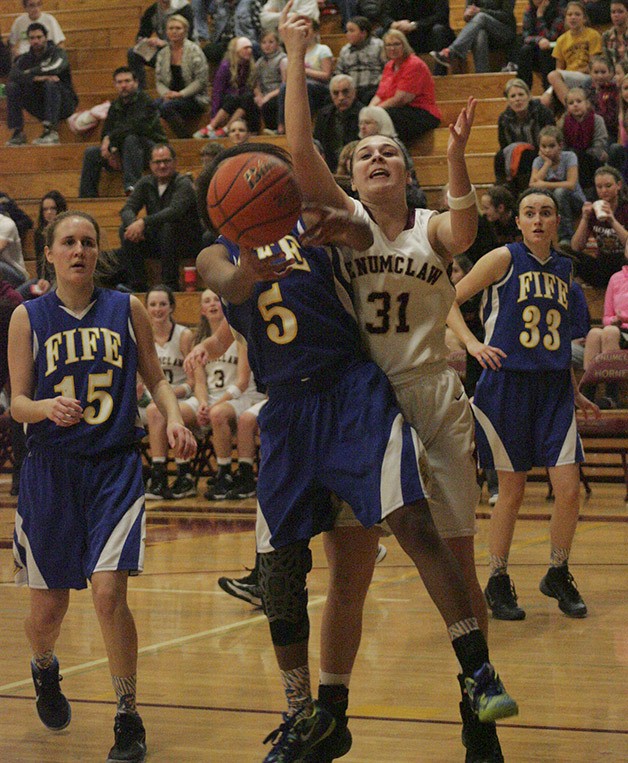 Madison Bosik fights for a rebound in the fourth quarter in the Hornets win over Fife Friday at home.