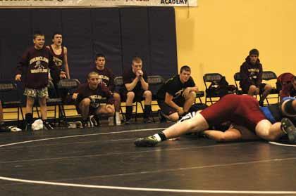 Enumclaw wrestlers encourage their heavyweight to pin an opponent during action at the Sumner Invite Saturday.
