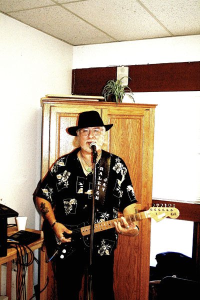 Guitarist and crooner extraordinaire Raliegh Jay dropped by the Buckley Senior Center Friday morning to furnish the entertainment at the center's annual progress report meeting. Known as the man of many voices