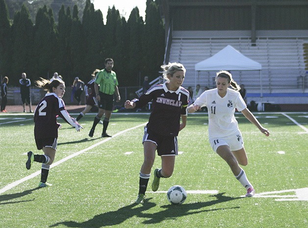 Panther junior Brooklyn Gratzer fights with Enumclaw senior Payton Hodgman for the ball during Saturday’s game. Bonney Lake won 3-1.
