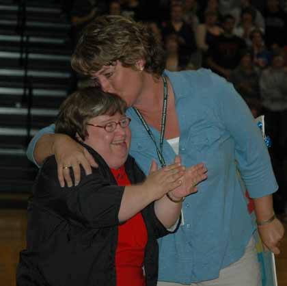 White River High teacher Karen Fugate embraces her sister Sharon