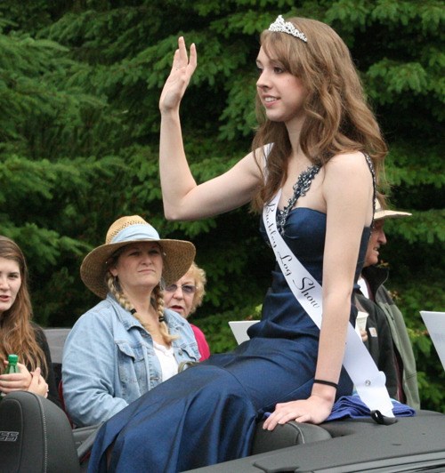 Buckley Log Show Queen Christina Ramous waves to spectators at the Wilkeson Handcar Race parade.