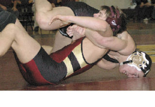 Enumclaw’s Connor Elder was trying to pick up back points during a battle with White River’s Michael Madden Thursday night. The two 160-pounders went three rounds before Elder captured the 12-7 victory.