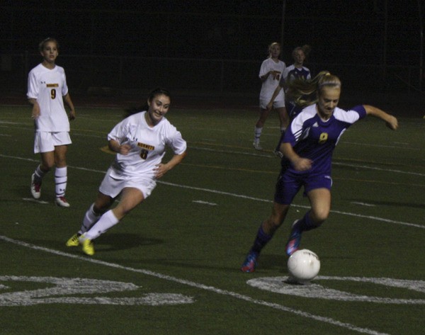 White River defender Mack Breeden pursues Alyssa Murray.