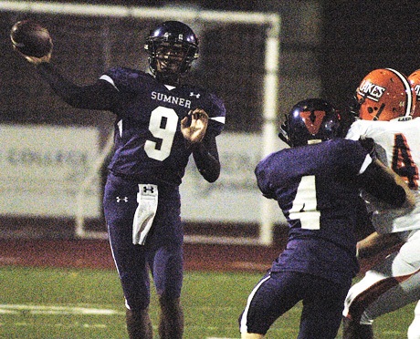Sumner QB Aaron Clark (9) throws downfield as Brennen Michelson (4) blocks a Lakes defender.