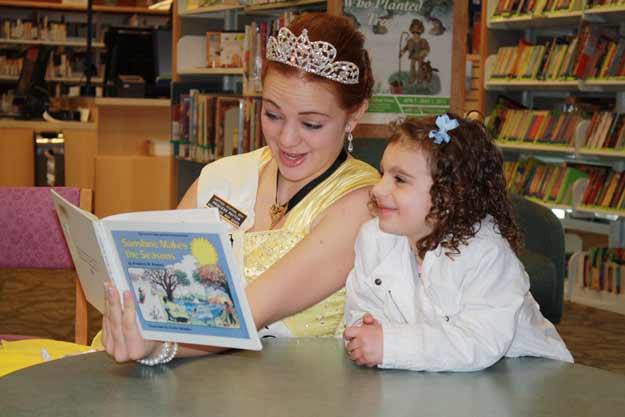 Bonney Lake High School Princess Payten Jensen reads to Mia Brancato