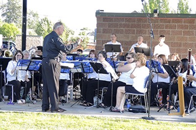 Rich Powers led the Puyallup Valley Community Band June 28 at Music off Main's opening concert.