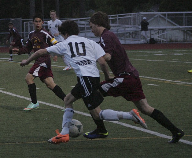 Bonney Lake senior Brody Fitzsimmons fights for the ball during the final regular season game Wednesday. The Panthers beat the Enumclaw Hornets 4-0.