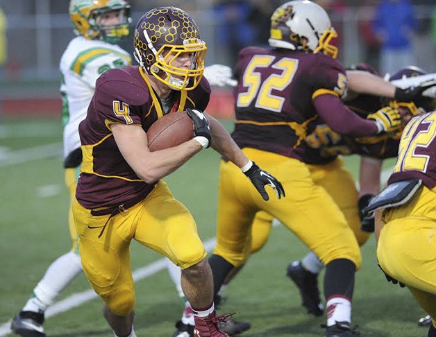 Keenan Fagan looks for an opening in the line against Tumwater Saturday at Orting High Stadium.  The Hornets lost 45-7.