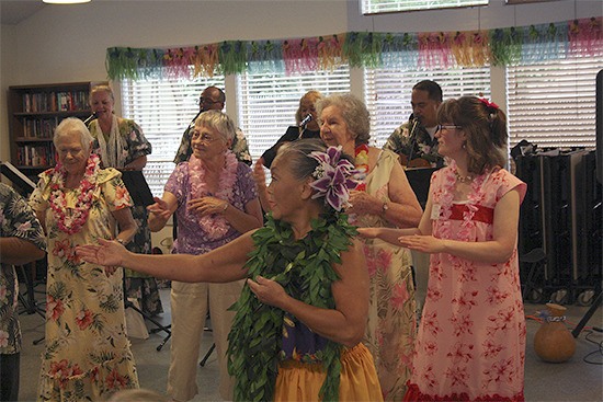 Moana Kokame leading seniors in a hawaiian dance.
