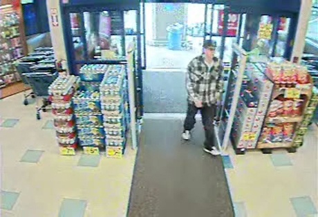 Photo shows a robbery suspect entering the Rite-Aid pharmacy in Bonney Lake on Aug.7.