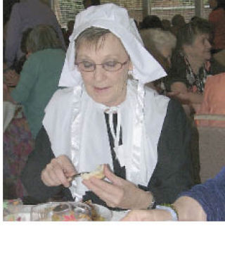 Judy Swain enjoys a Thanksgiving meal Friday at the Bonnney Lake Senior Center.