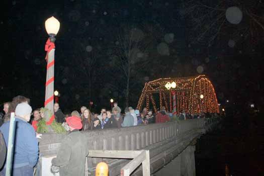 Hundreds of residents stream across the Puyallup River during the annual bridge lighting event Nov. 26 in Sumner.