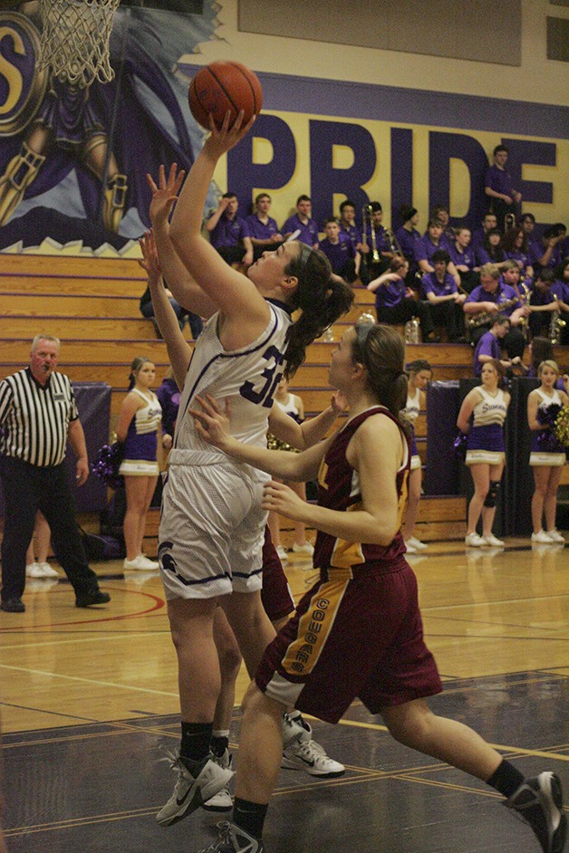 Sumner senior Jamie Lange takes a shot during Wednesday's home game against Capital. The Spartans won 57-31 in the first game of districts.