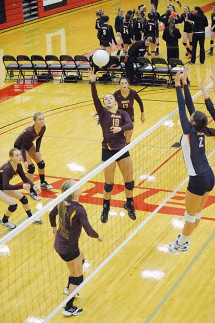 Enumclaw's Danielle Saltarelli tips a ball back over the net during play at the 3A state volleyball tournament Friday.