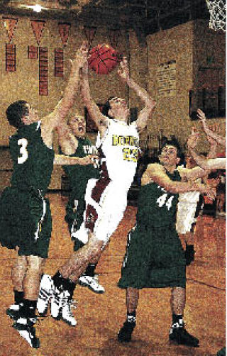 Jake Bailiff goes up for two points during a home loss to Peninsula High.