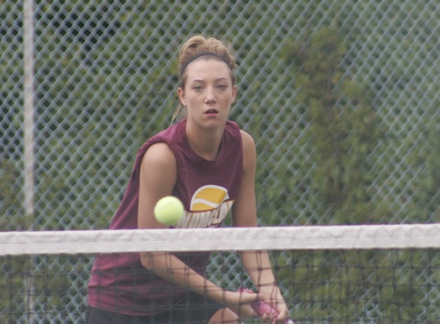Enumclaw High’s Kayla Zilbauer returns a volley during last weekend’s district tournament at the Sprinker Tennis Center. Zilbauer and partner  Camille Clare earned the No. 6 seed from districts and will participate in the upcoming Class 3A state tournament. Another EHS doubles team