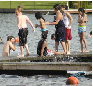 A group of youngsters enjoy time at Allan Yorke Park as hot temperatures made swimming and enjoying the water possible. People took advantage of the weather for relaxation and recreation activities.