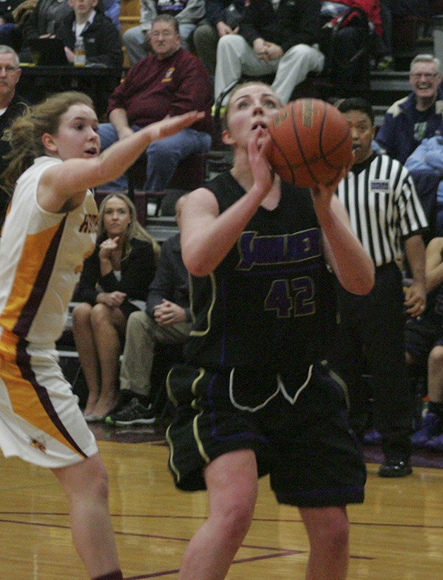 Sumner senior Madi Henken looks to make a basket Friday against the White River Hornets. The Spartans fought hard and beat the Hornets 42-38. With the win