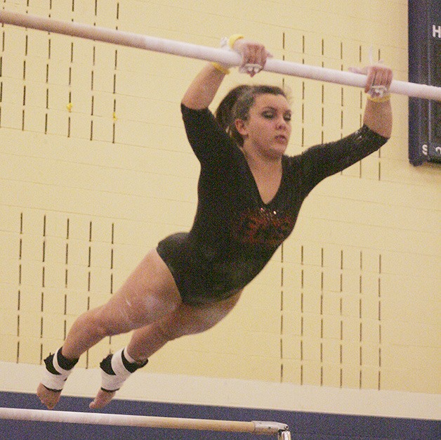 Emily Berte on the bars for Enumclaw at the district meet Saturday.