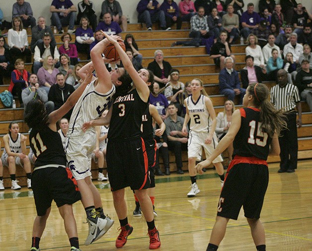 Spartan Jamie Lange muscles up a shot in the post against Central Kitsap.