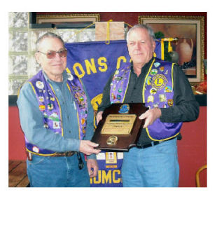 Joe Chase received the Melvin Jones Fellowship during a recent Lions Club event. Making the presentation is Miles Moergeli.