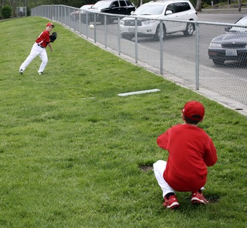Little leaguers warm up for a game at Allan Yorke Park on Friday afternoon.