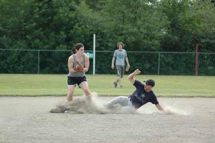 Hillside Community Church's Emily Carothers and Mount Rainier Christian Center's Tad Covey make it close at second.