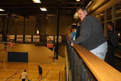 Bonney Lake Councilmember Mark Hamilton watches pickle ball being played during a tour of the Gig Harbor YMCA facility July 16.