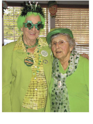 Myrtis Mason and Florence Massey pose for the camera at the St. Patrick’s Day celebration at the Bonney Lake Senior Center.