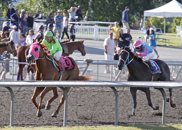 Del Rio Harbor and jockey Gallyn Mitchell holding off Noosito and jockey Leslie Mawing in the $50