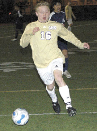 Sumner High’s Brandon Denny takes the ball downfield during a Spartan victory over the Lakes Lancers.