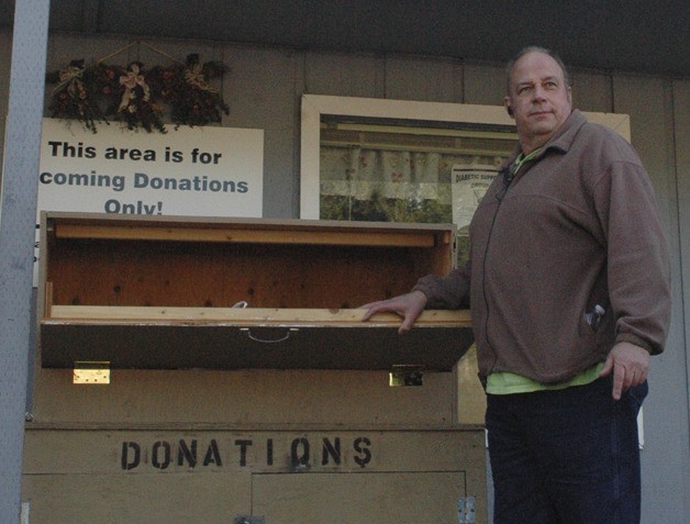 Director Stew Bowen poses in front of the Bonney Lake Food Bank. The city of Bonney Lake is seeking a grant to rebuild the aging building.