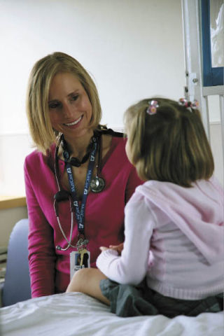 Dr. Suzanne Ingrao with Mary Bridge Pediatric Care at Good Samaritan talks over summer safety with a young patient.