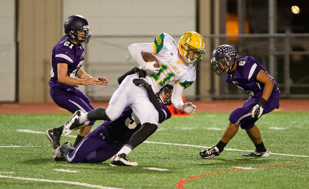 Spartan Defenders pull down a Lynden runner during a 42-7 loss Nov. 17 at Sunset Chev Stadium.