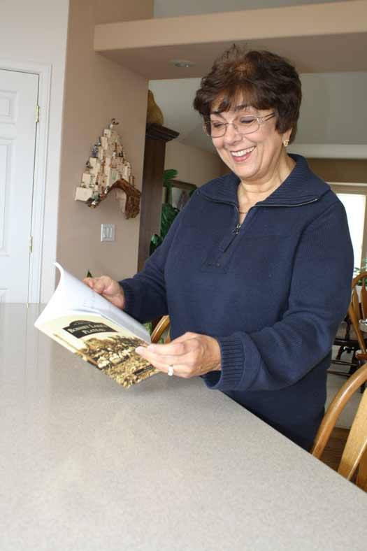 Winona Jacobsen flips through an advance copy of her book