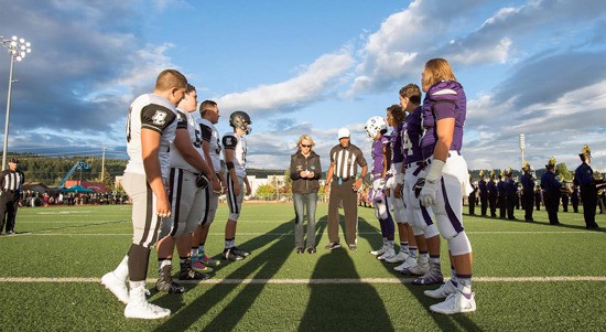 Sumner and Bonney Lake prepare for the flip of the coin at Sunset Stadium last Friday in the Sunset Bowl.