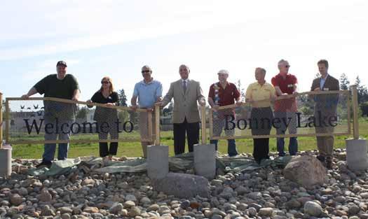 Bonney Lake City Council Members and Mayor Neil Johnson pose for a photo after unveiling the Eastown welcome sign May 8.