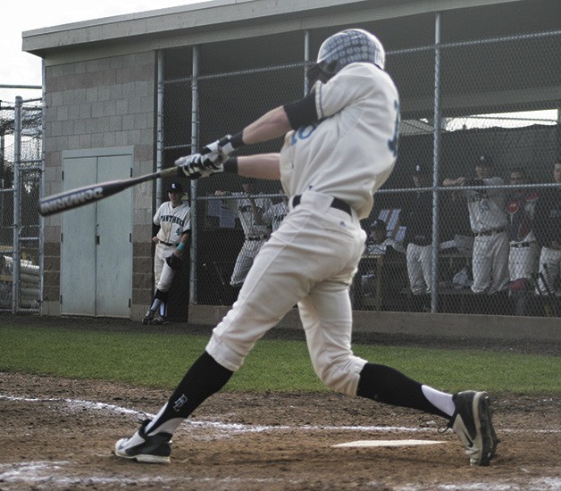 Michael Gretler swings for the fence during the Panthers April 2 win over Enumclaw.