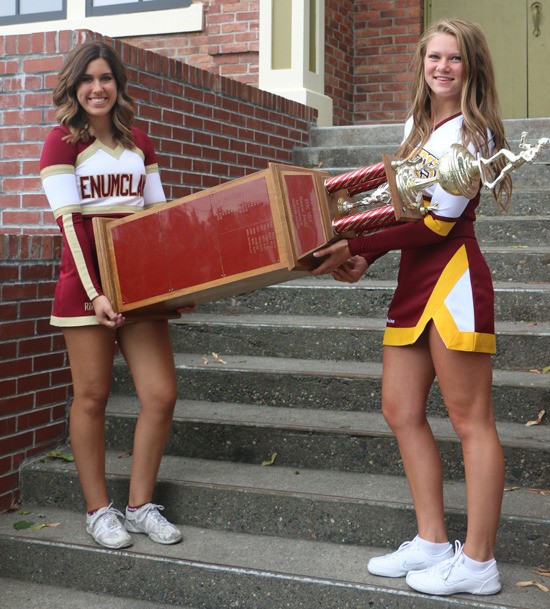 Leading up to the “Battle of the Bridge” – the annual football contest between Enumclaw and White River high schools – cheerleaders from each side of the river came together last week to re-create a photograph originally taken in 1969.