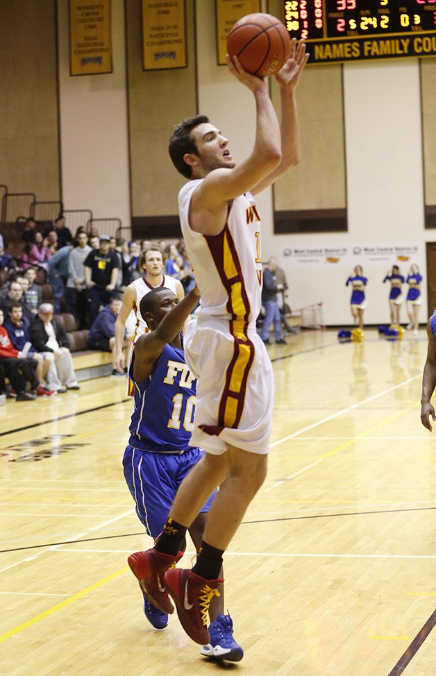 Brandon Dove launches a short jumper during White River’s district victory over Fife. Photo by Kyle Stroh.